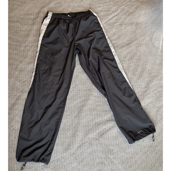 Nike Track Pants M Black Partial White Leg Stripe Swoosh Toggle Cuffs Workout - Picture 1 of 10